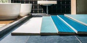 100% waterproof vinyl plank flooring samples for a bathroom with their protective core layers visible.